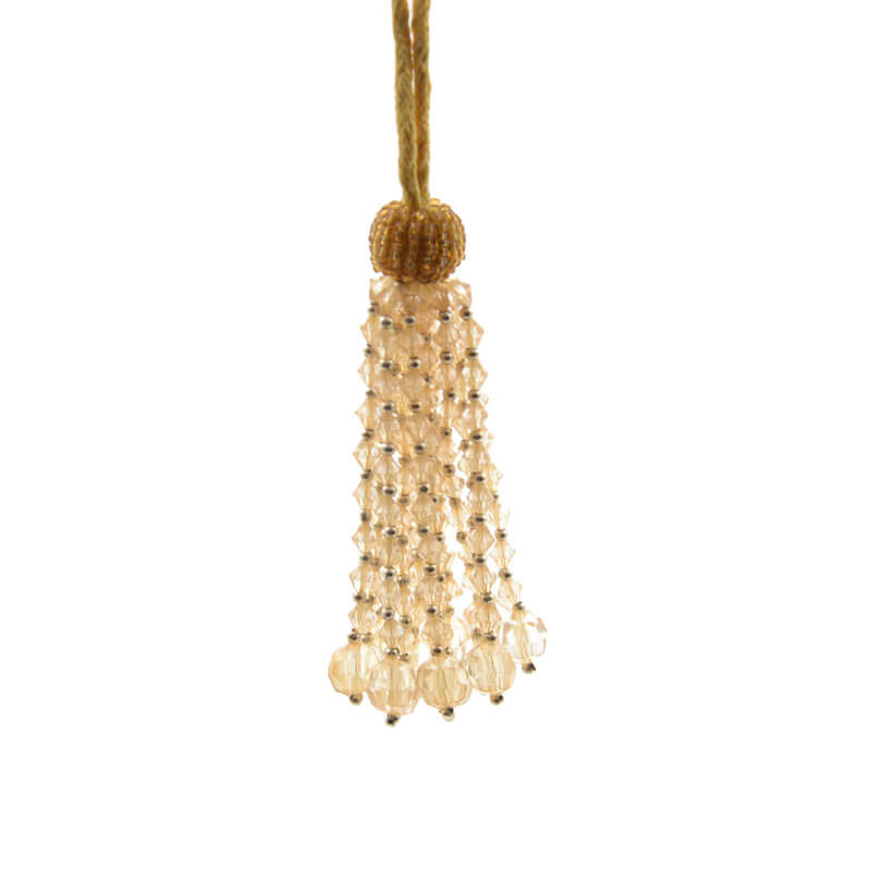 Borla de pedrería en color oro de 8 cm