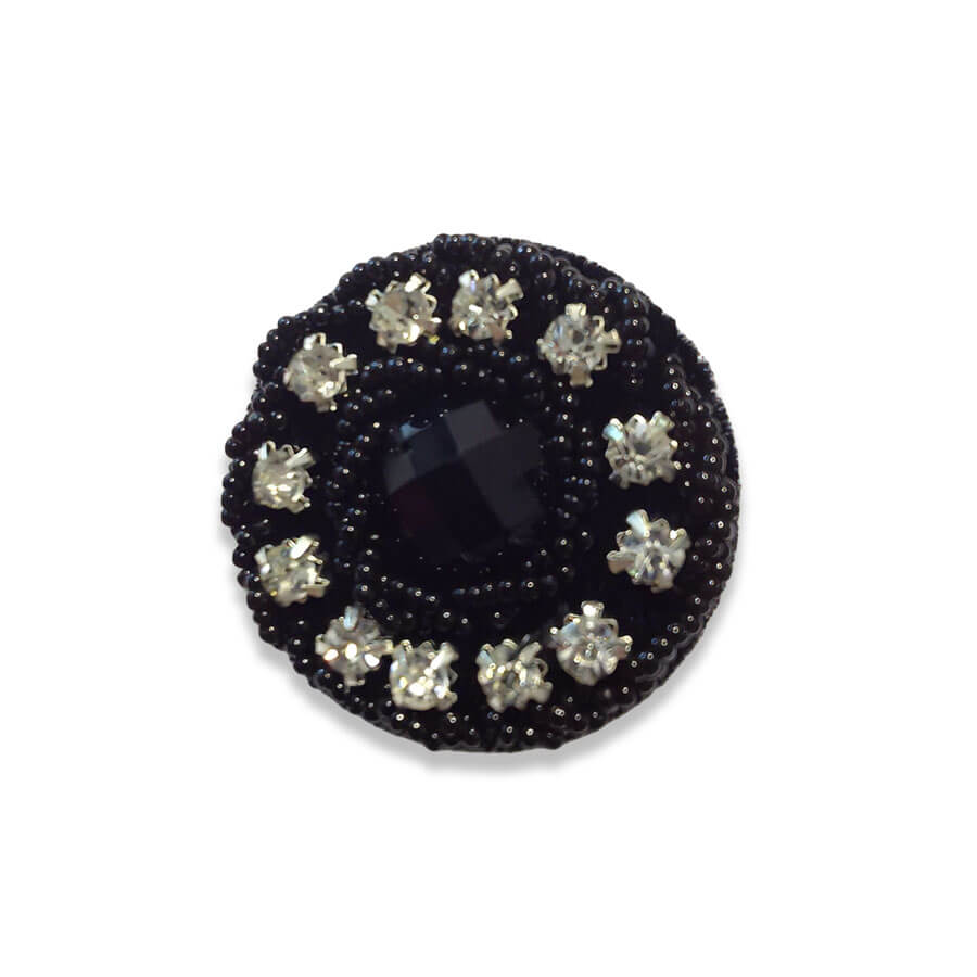 Botón strass negro con cristales transparentes
