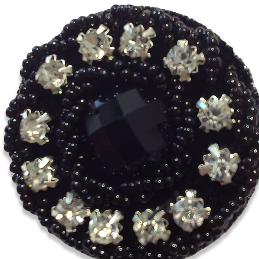 Botón strass negro con cristales transparentes